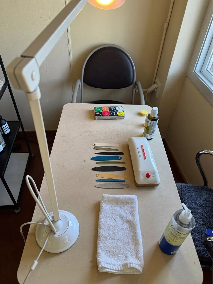 A manicure station and client chair in the salon